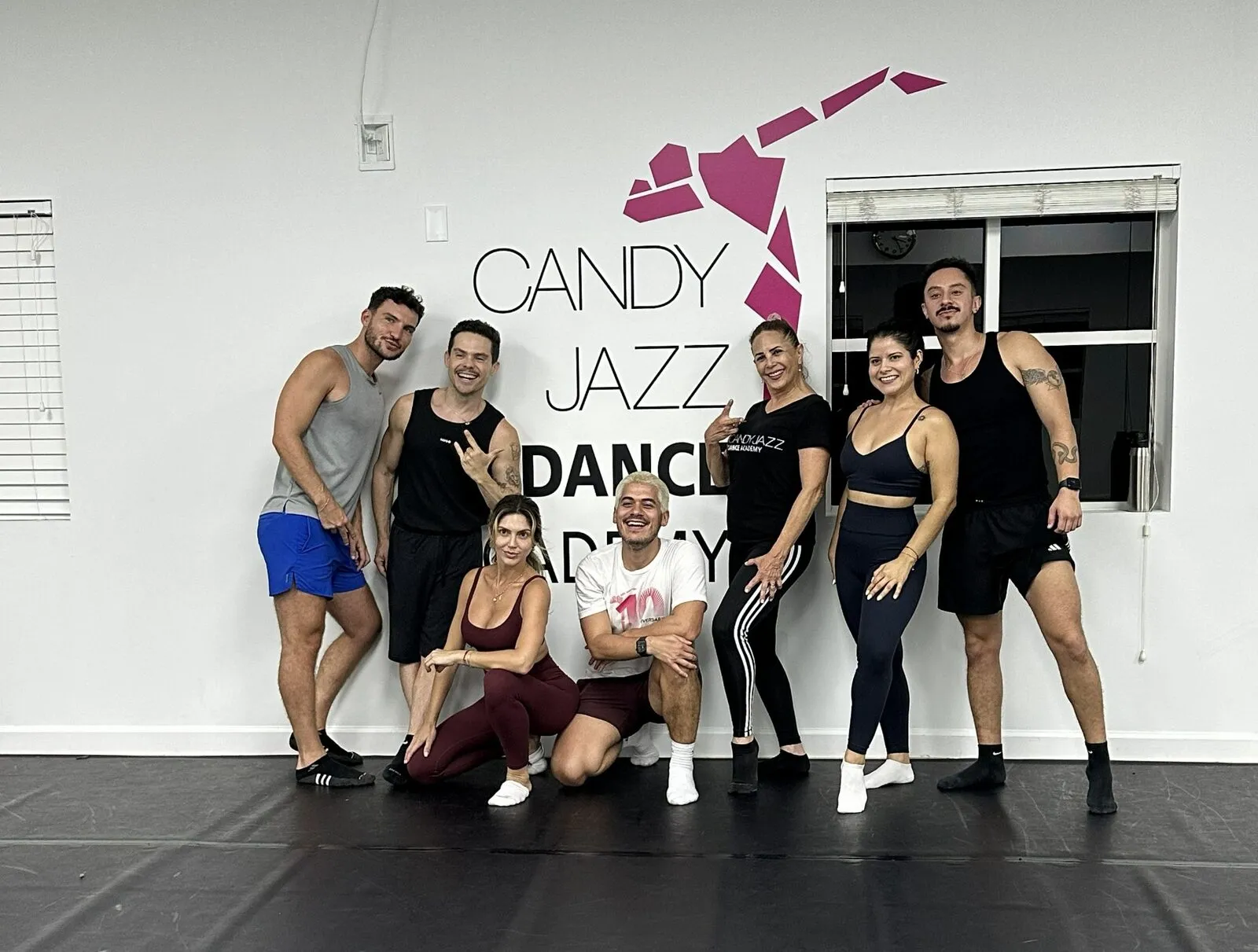 Adult Jazz students and instructors posing together in the Candy Jazz studio