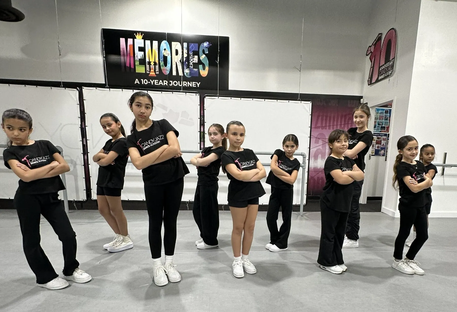 Candy Jazz hip hop students posing together in the studio