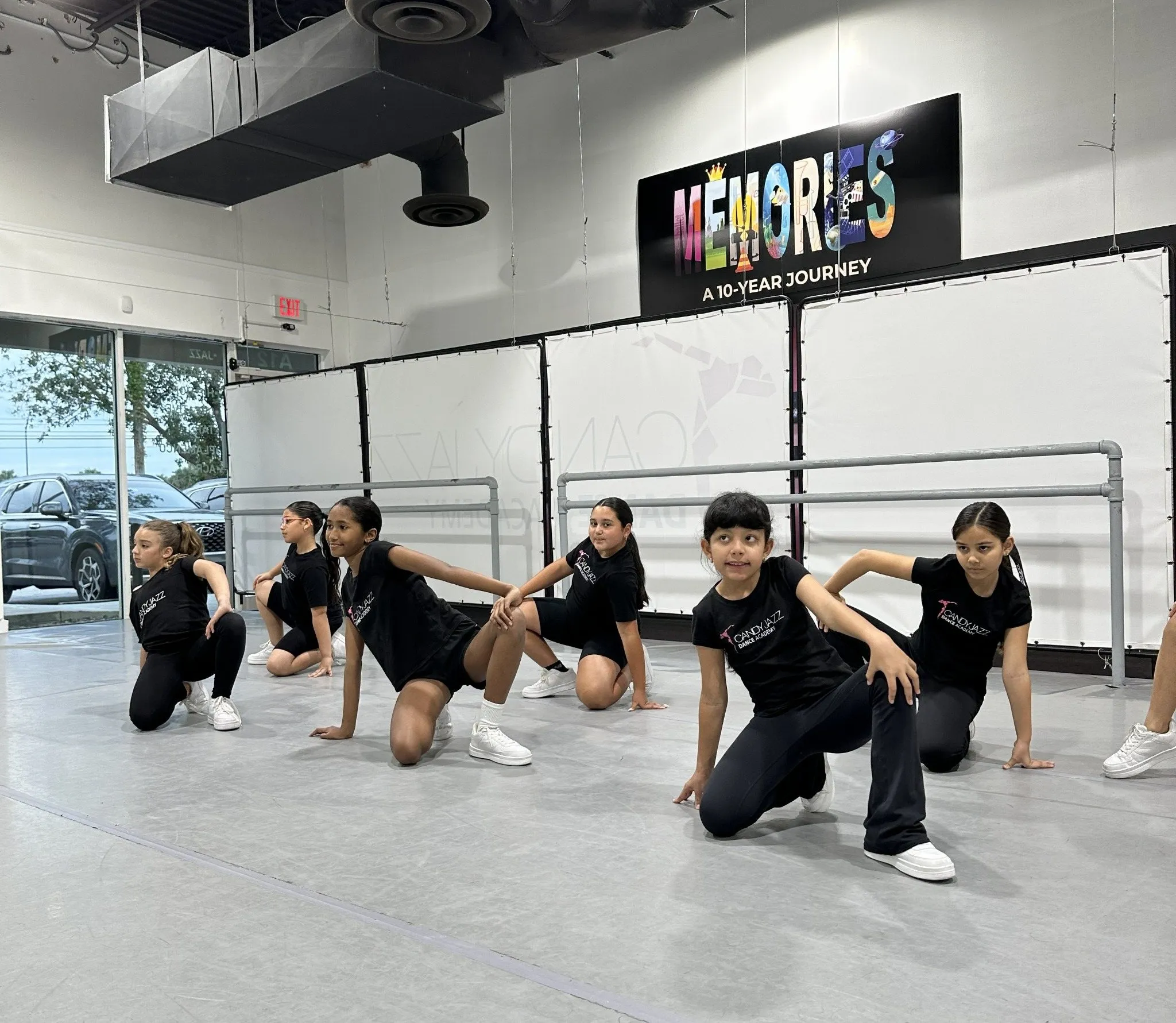 Candy Jazz hip hop students dancing in a studio formation