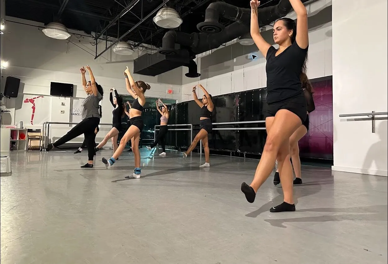Candy Jazz dancers practicing contemporary movement in the studio