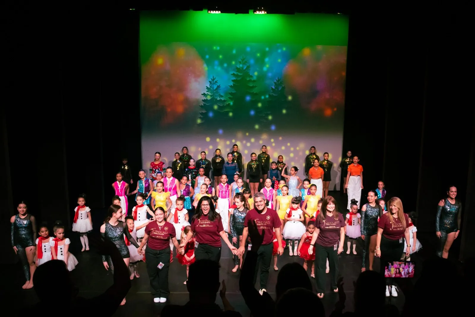 The full company on stage